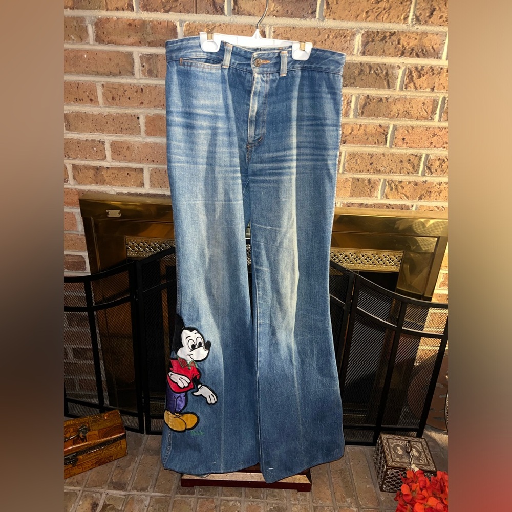 Mickey Mouse 27” long patch on bottom of fun flare wide bottom 33” waist jeans